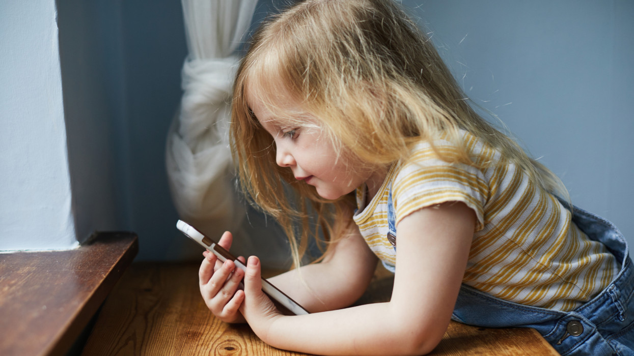 Toddler girl using a smartphone