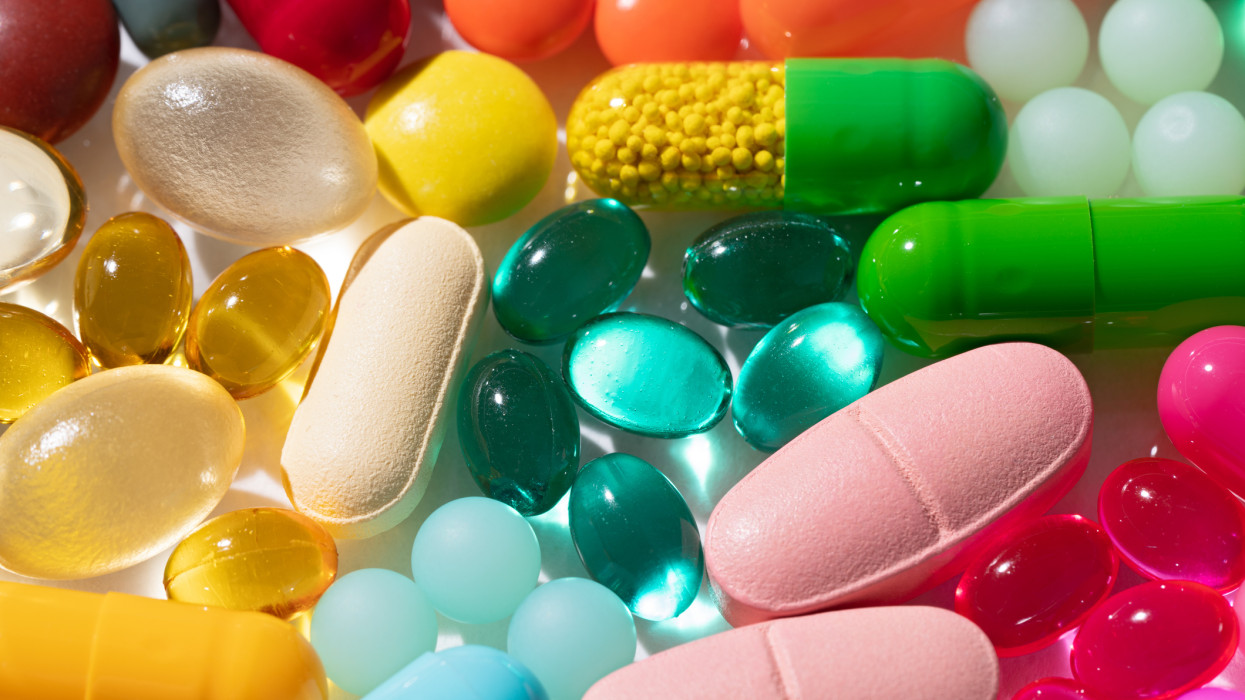 A Variety of Multi Colored Medicine Pills and Capsules Close-up View.