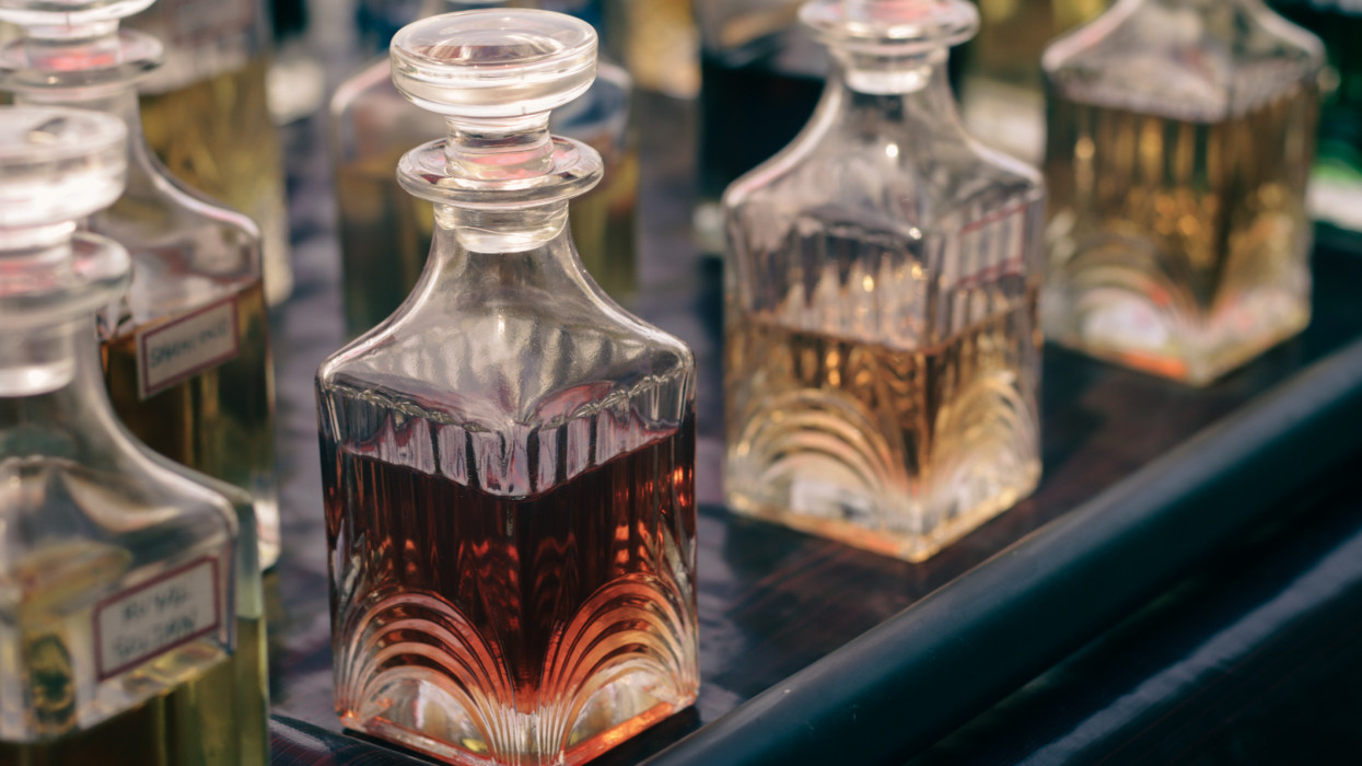 Glass bottles filled with colourfull perfumes, being sold on a Street side. Organic perfumes are made by natural ingredients and are so Fresh to smell.