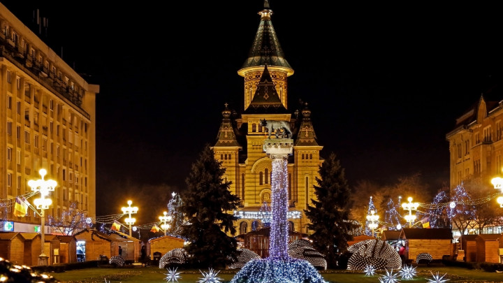 Timisoara, Romania - December 14, 2016: Christmas arrangements in Victory Square, Timisoara, Romania, with orthodox cathedral in background.
