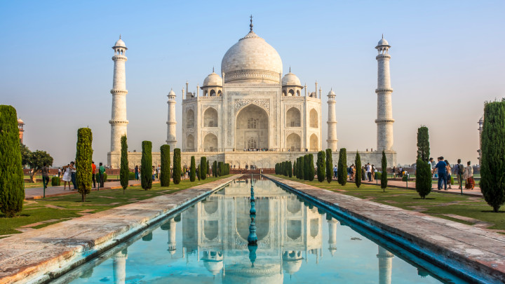 The Taj Mahal (more often meaning Crown of the Palace) is an ivory-white marble mausoleum on the south bank of the Yamuna river in the Indian city of Agra.